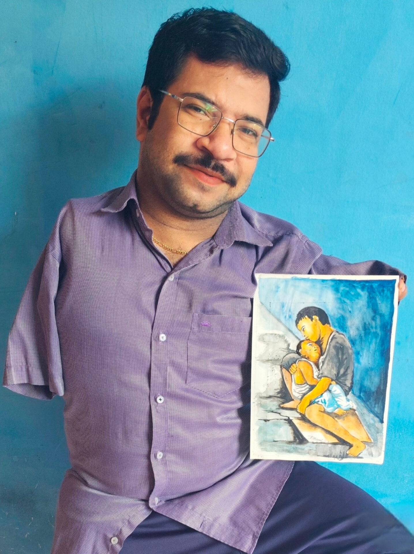 Dhiraj showcasing his artwork